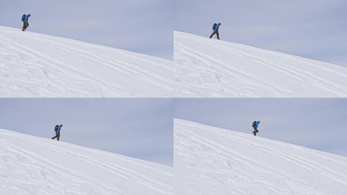 徒步旅行者在白雪皑皑的山上行走