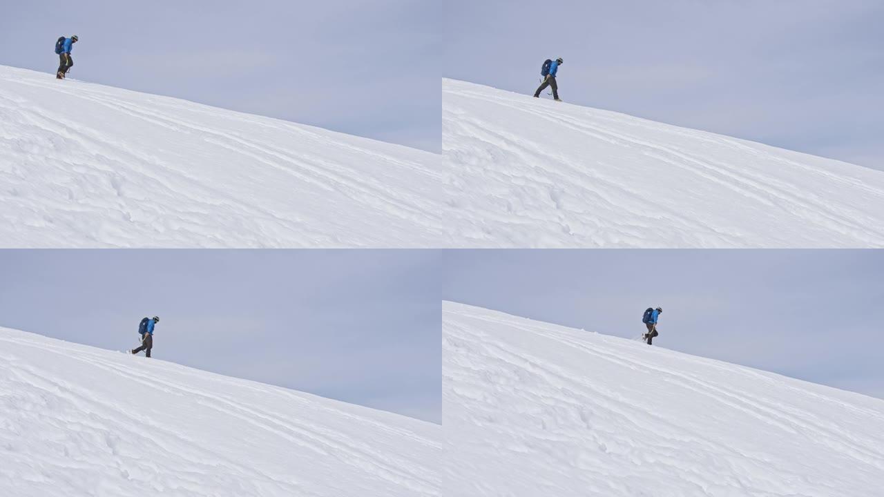 徒步旅行者在白雪皑皑的山上行走