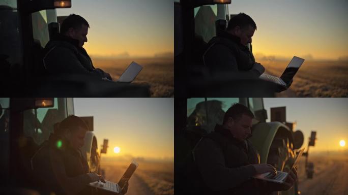 男性农民在日出时在农田拖拉机上使用笔记本电脑