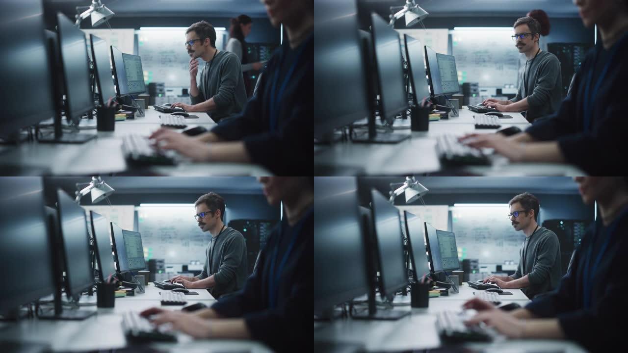 在技术办公环境中，一位周到的工程师在台式计算机上工作的肖像。研发部门为一个创新的互联网项目编写软件代