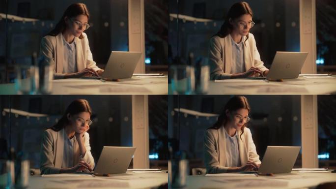 晚上在公司办公室工作的时尚女性在笔记本电脑上工作。年轻的经理浏览互联网，在线购物并阅读朋友和同事的社