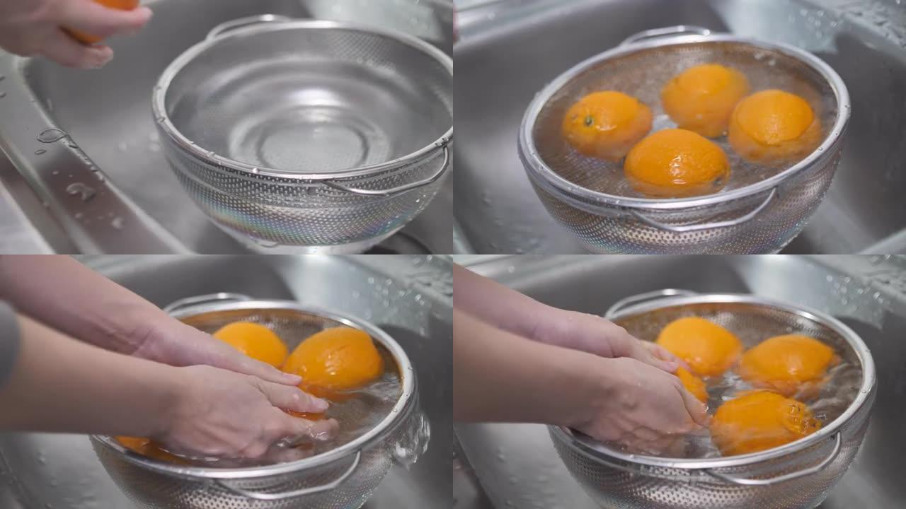 女人吃饭前洗橘子