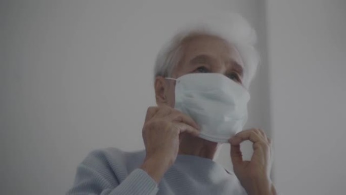 亚洲老年妇女戴口罩保护病毒冠状病毒