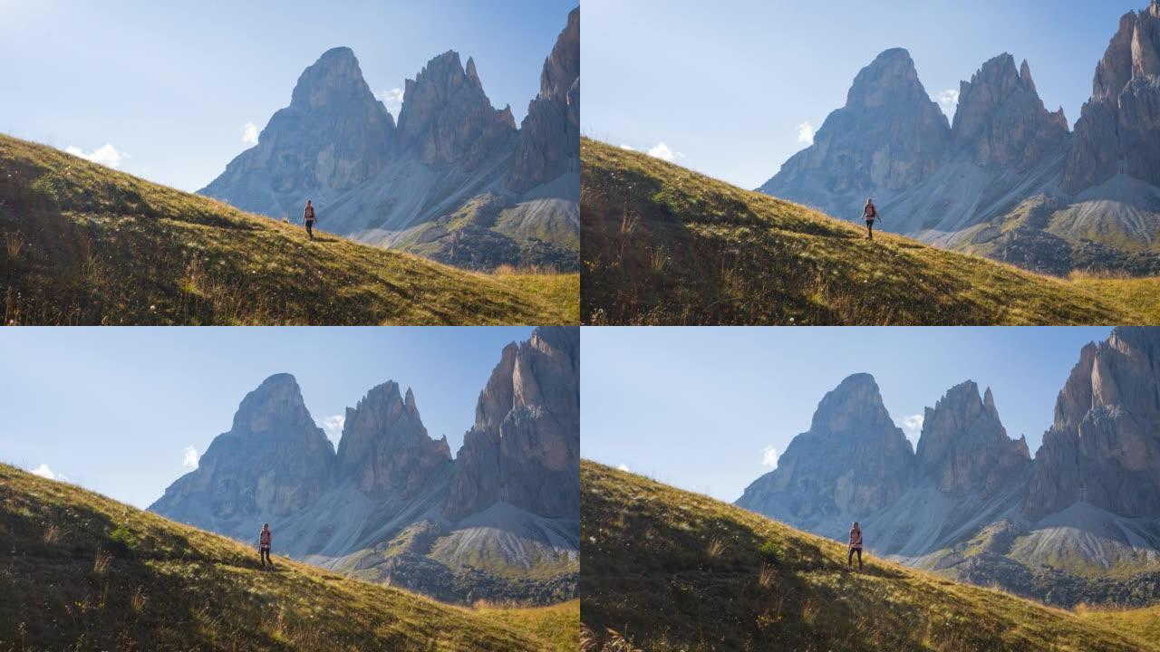 身体意识强的女人在风景如画的山区户外徒步旅行