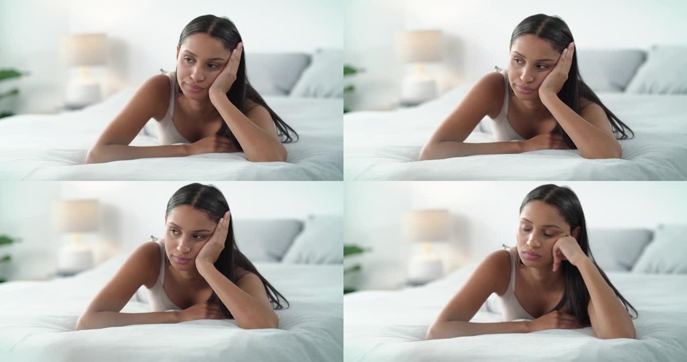 4k视频片段，一名年轻女子在家中床上感到不快乐