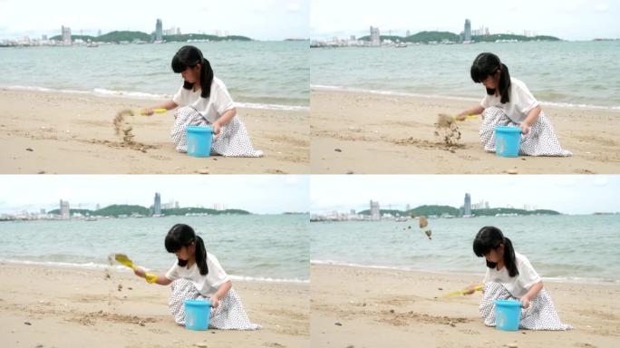 小女孩在沙滩上玩耍