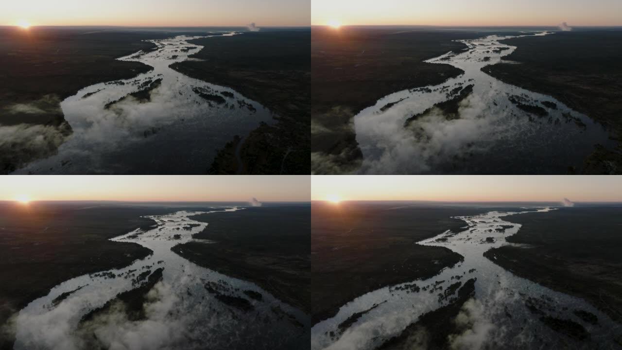 巨大的赞比西河流向联合国教科文组织世界遗产维多利亚瀑布的高空日出