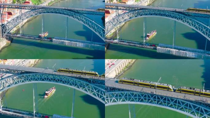 在波尔图杜罗河上的路易斯一世桥上的电车无人机视图