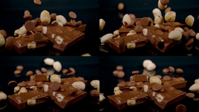 宏观: 坚果和巧克力片散布在几方圆的乳白色巧克力上。
