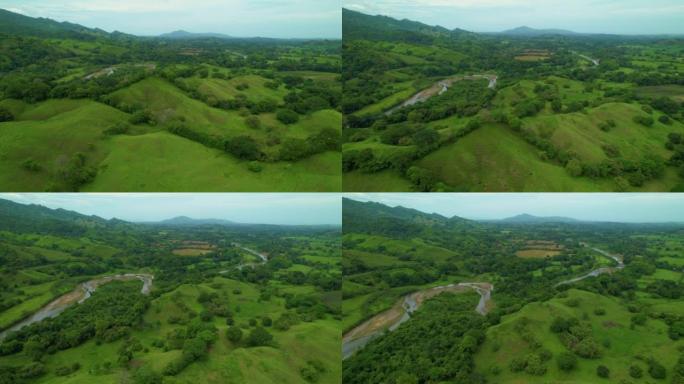 空中: 蜿蜒的溪流在巴拿马的热带乡村上空飞行