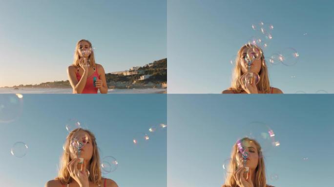 快乐的年轻女子日落时在海滩上吹泡泡，享受夏天在海边度假的乐趣