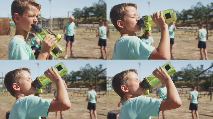 高加索男孩在新兵训练营喝水