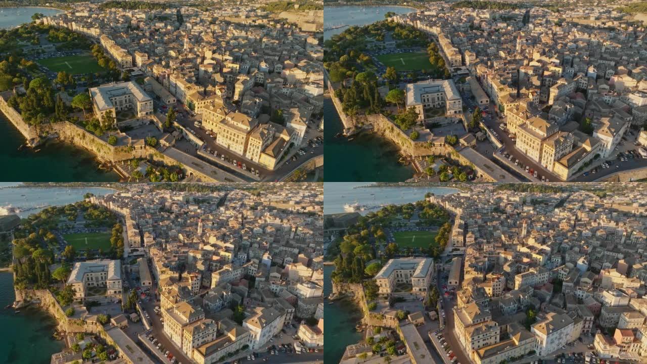 希腊科孚岛首府Kerkyra的空中早晨拍摄。飞越科孚岛Kerkyra的建筑物，公园和海洋