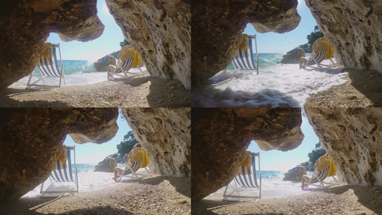 年轻女子女士在克罗地亚亚得里亚海阳光明媚的海洋海滩上的椅子上放松