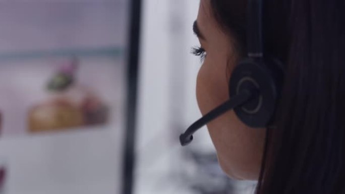 呼叫中心代理在与客户交谈时使用计算机的4k视频片段