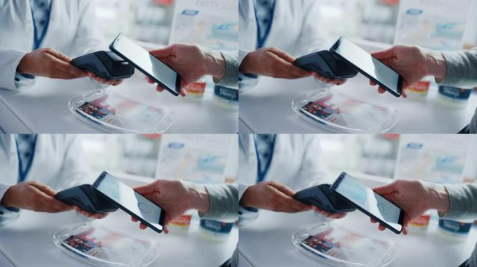 药店药店收银台: 药剂师和一位客户使用NFC智能手机与非接触式支付终端购买处方药、保健品。专注于终端