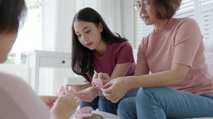 团体亚洲妇女研讨会乳腺癌宣传运动丝带。