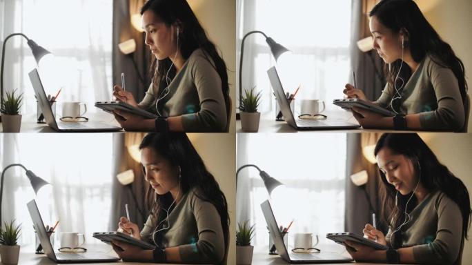 女人在家里的笔记本电脑上学习