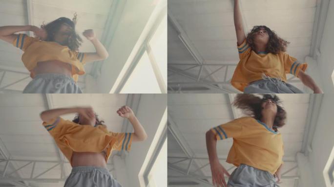 4k视频片段，一位迷人的年轻女子在演播室跳舞