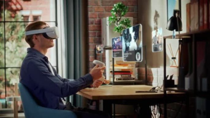 兴奋的年轻人坐在家里的阁楼客厅，使用带有控制器的虚拟现实耳机检查社交媒体流媒体应用程序。男性选择观看