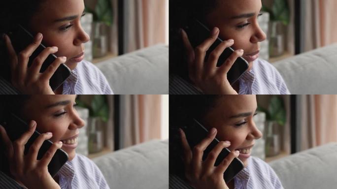 年轻的非洲裔美国妇女拿着手机通话。