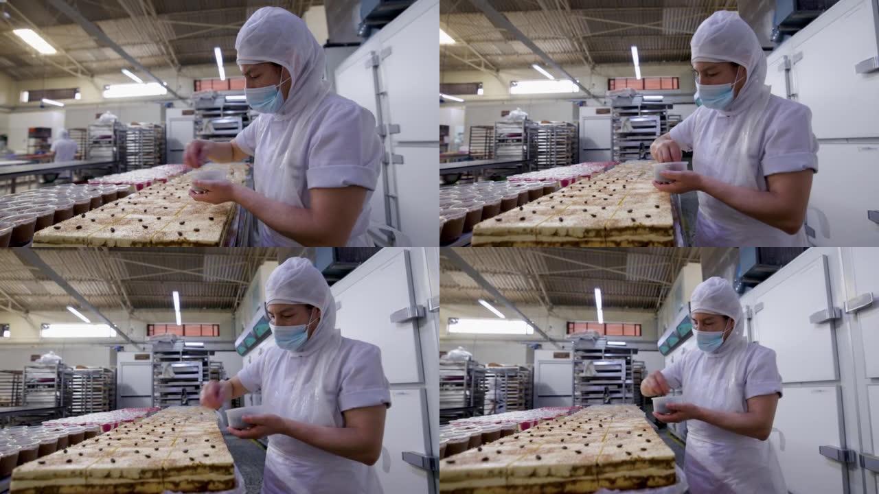 专注于工业面包店的女人用咖啡豆装饰提拉米苏