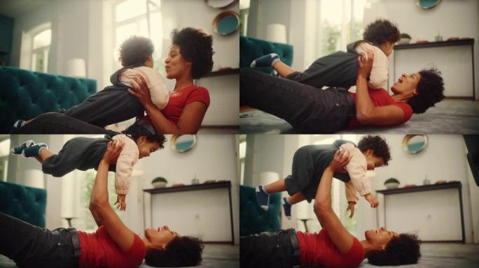 美丽的黑人拉丁母亲在客厅地板上在家和可爱的小男孩玩耍。开朗的妈妈养育孩子。快乐的儿子在空中长大。童年