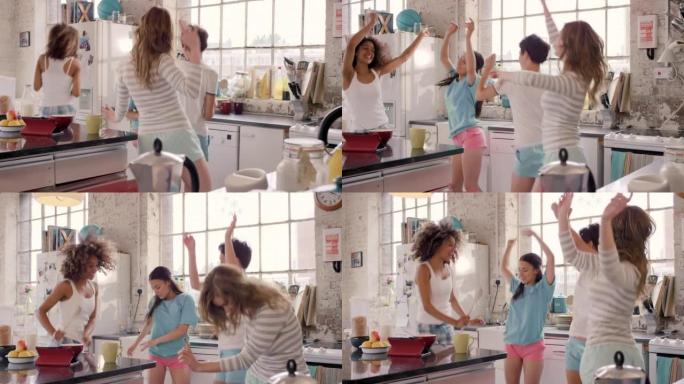一群朋友在厨房里一起跳舞的4k视频片段