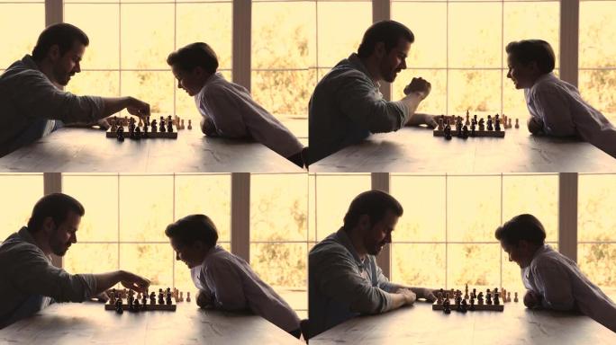 年轻的父亲和小聪明的儿子下棋游戏