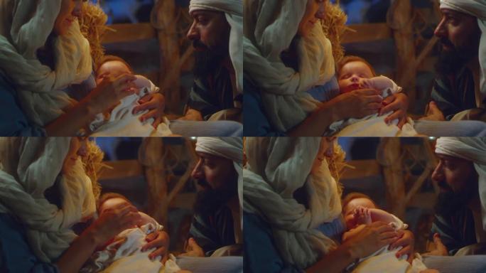 玛丽和约瑟夫欣赏熟睡的婴儿耶稣