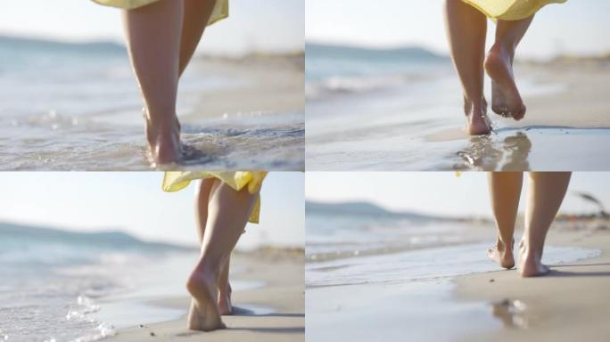 撒丁岛海滩上散步的女人的脚的特写镜头。