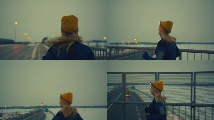 SLO MO女人在寒冷的傍晚慢跑过桥