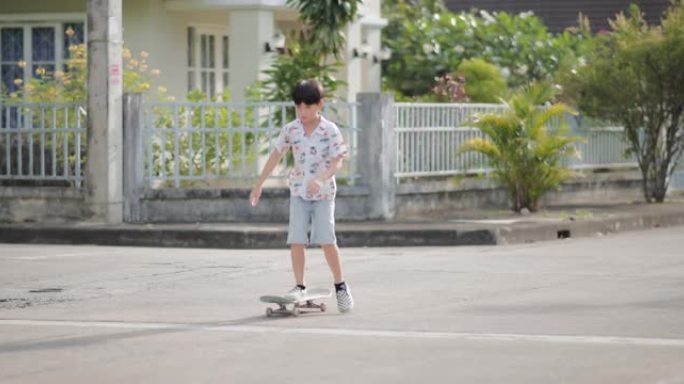 玩滑板的亚洲男孩童年时光你儿童运动