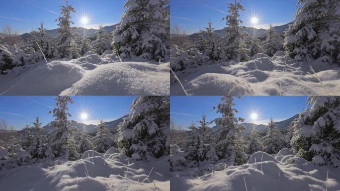 森林和山脉中的冬季童话。相机在雪山上移动，雪在早晨的阳光下闪闪发光。山里的冬天，万向节射击