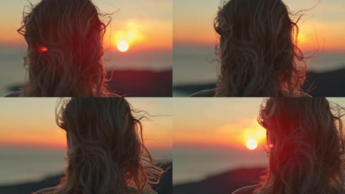 超级SLO MO女人享受着惊人的海景和美丽的日落