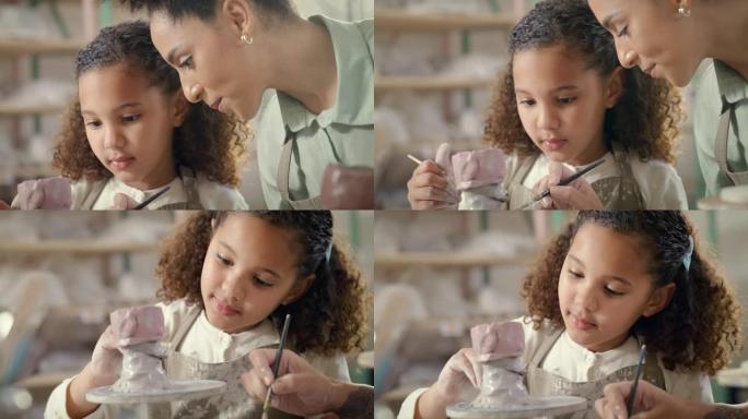 母亲、孩子和艺术，同时绘画、陶器和创造性的家庭学习工艺，促进发展、结合和爱。女童和妇女用油漆刷用粘土