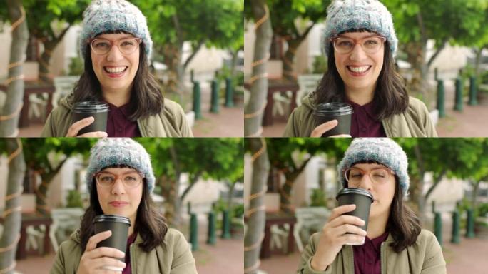 在城市旅行时享受咖啡的幸福女人。一个戴着眼镜和无檐小便帽的前卫年轻女子的肖像，在市区游览和观光时态度