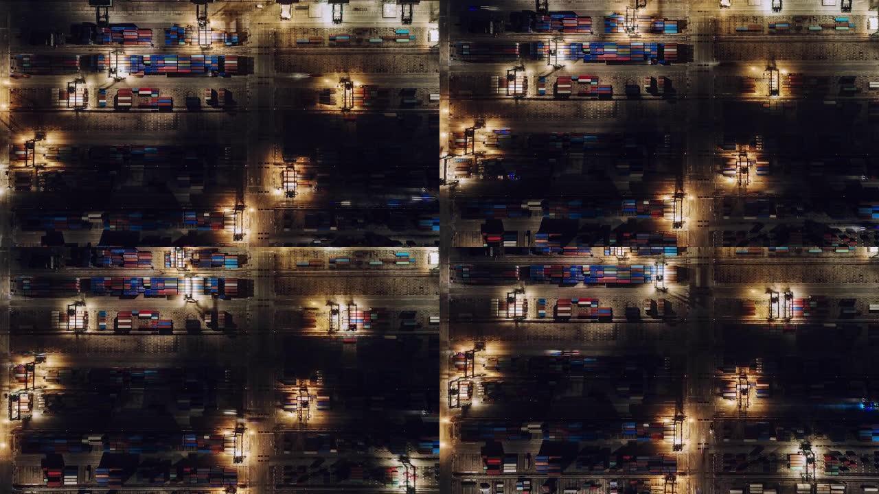 夜间集装箱运输繁忙工业港口的T/L PAN鸟瞰图