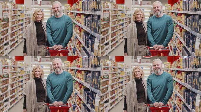 超市中带购物车的成年夫妇肖像