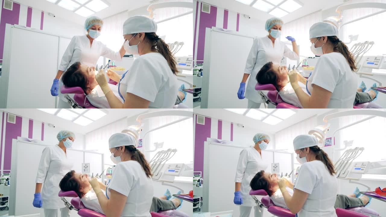 牙医正在固定女性患者的牙齿