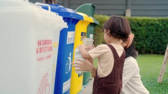 亚洲母亲教她的儿子如何回收废物。