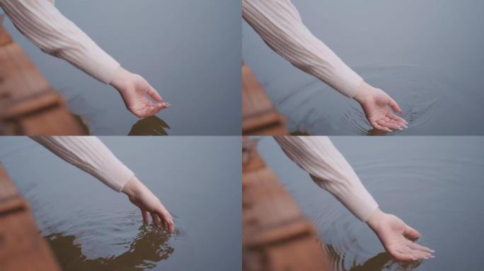 女人在湖中玩清水手指手掌视频素材
