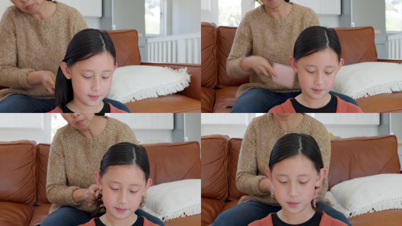 母亲，亚洲女孩和梳头照顾，结合和连接护发，自然美，并在客厅一起放松。妈妈、孩子和梳子发型，爱或做早上