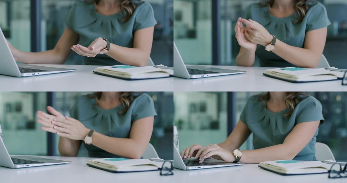 4k视频片段，一位无法识别的女商人在现代办公室的办公桌前对双手进行消毒