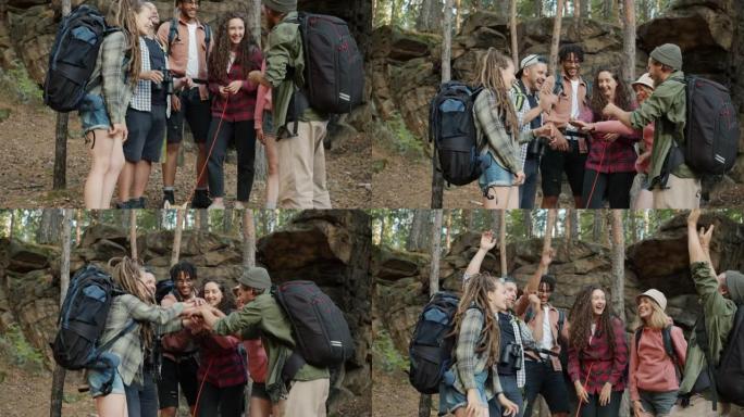 最好的朋友的慢动作游客携手表达联系和团结，一起站在森林里