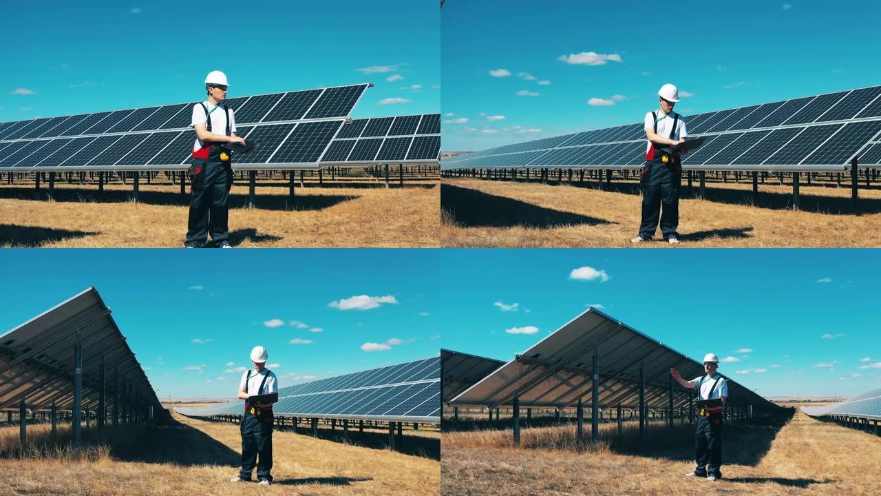 男性专家正在观察一个太阳能发电站