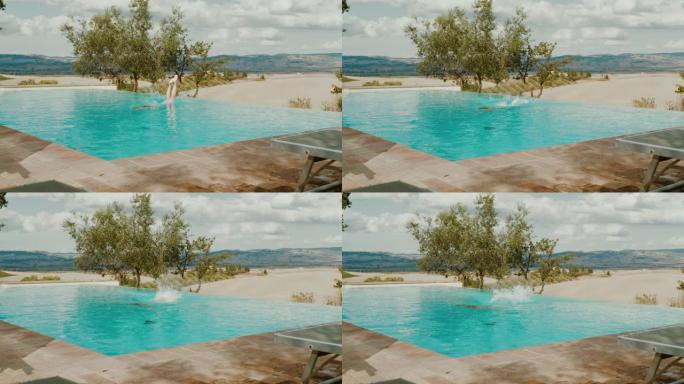 超级SLO MO女人跳入托斯卡纳度假别墅的游泳池