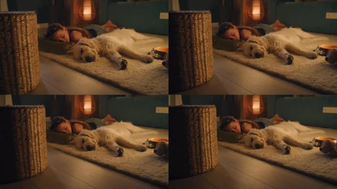年轻女孩和狗睡在温和的地毯上