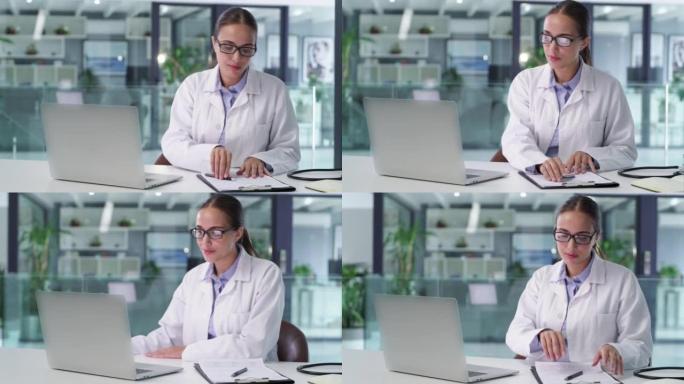 一位自信的医生在医疗办公室工作笔记本电脑。值得信赖的女医生和专业的医疗保健从业者在医院进行研究和浏览