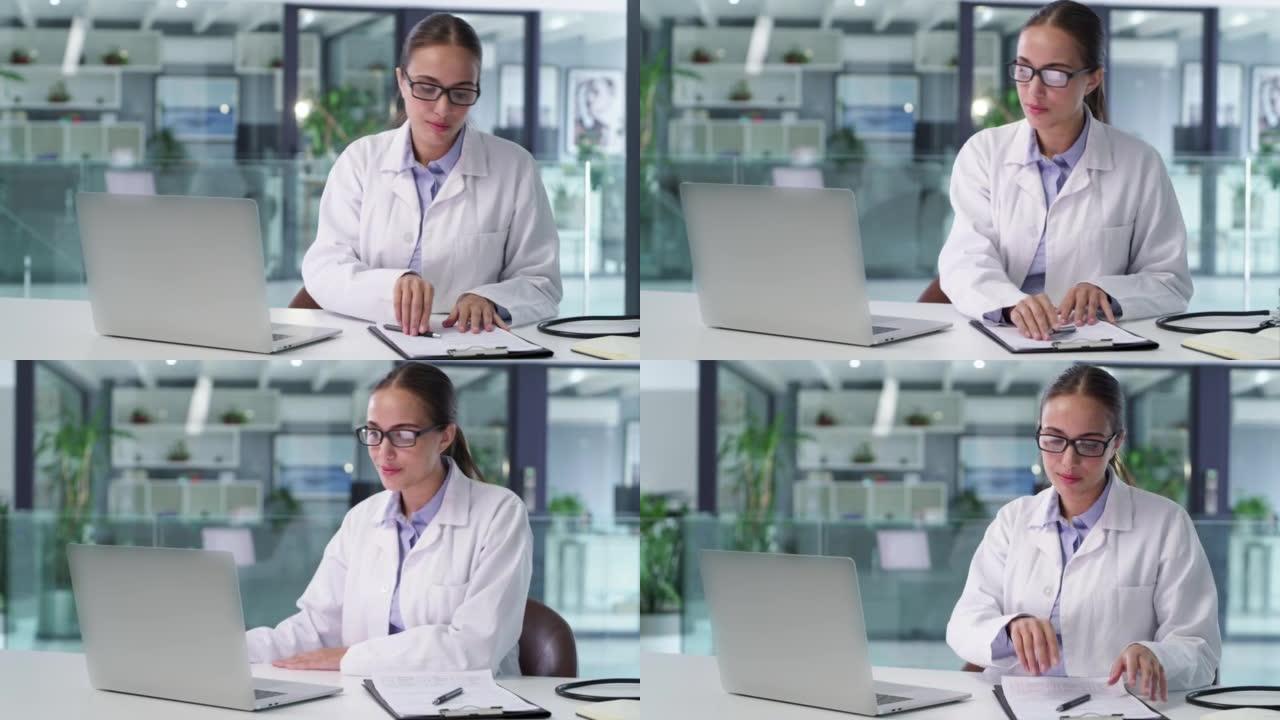 一位自信的医生在医疗办公室工作笔记本电脑。值得信赖的女医生和专业的医疗保健从业者在医院进行研究和浏览